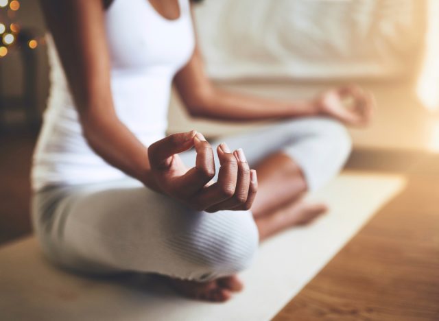 woman bedtime yoga meditation concept
