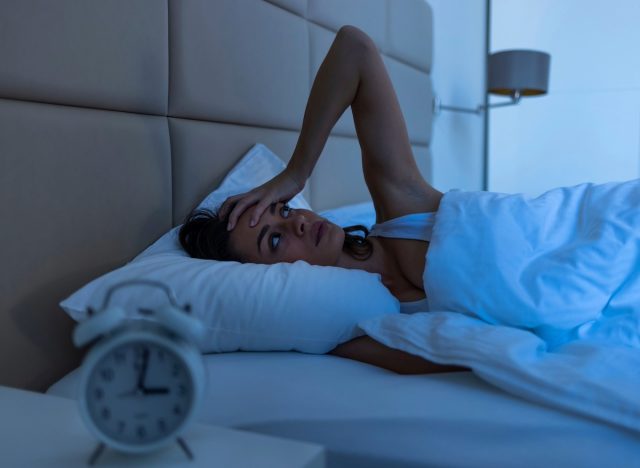 woman can't sleep, concept of bad habits that cost hours of sleep