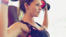 woman doing dumbbell press, concept of morning workouts to speed up weight loss