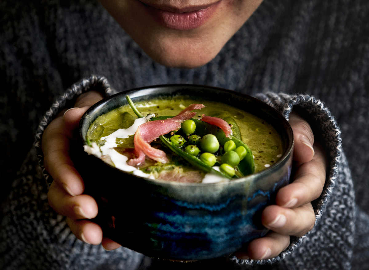 woman holding bowl of soup