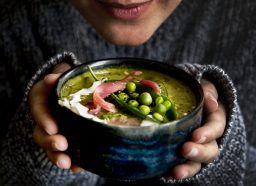 woman holding bowl of soup