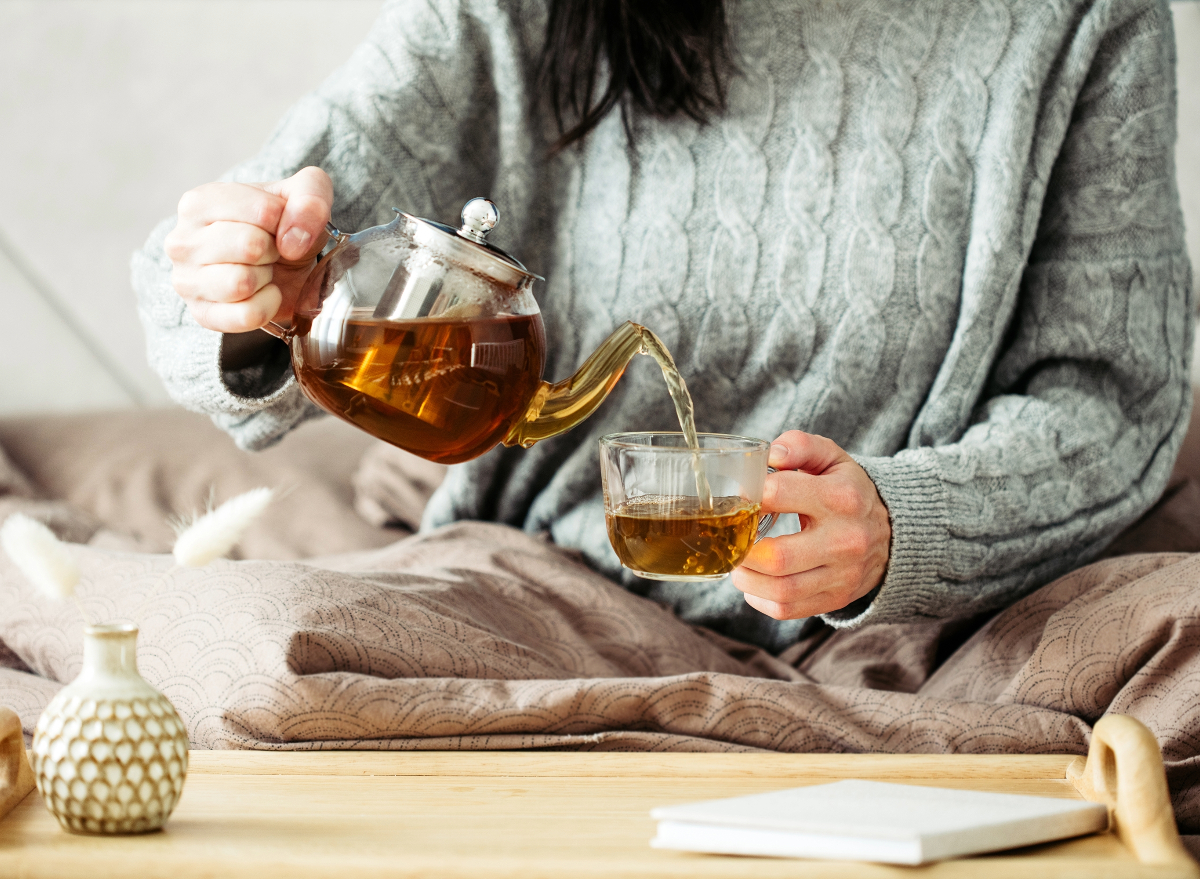 woman pouring tea, concept of ways to speed up metabolism