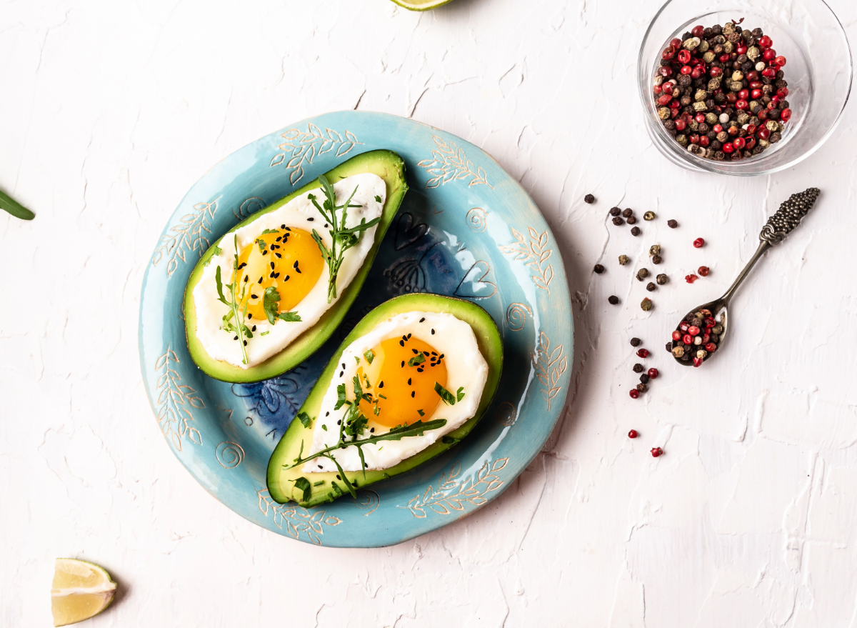 avocado baked eggs, concept of full-fat foods for weight loss