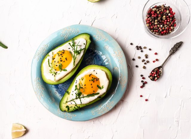 avocado baked eggs, concept of full-fat foods for weight loss