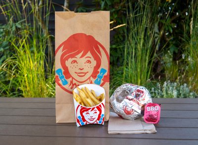 Wendy's burger, fries, bbq sauce, and to-go bag