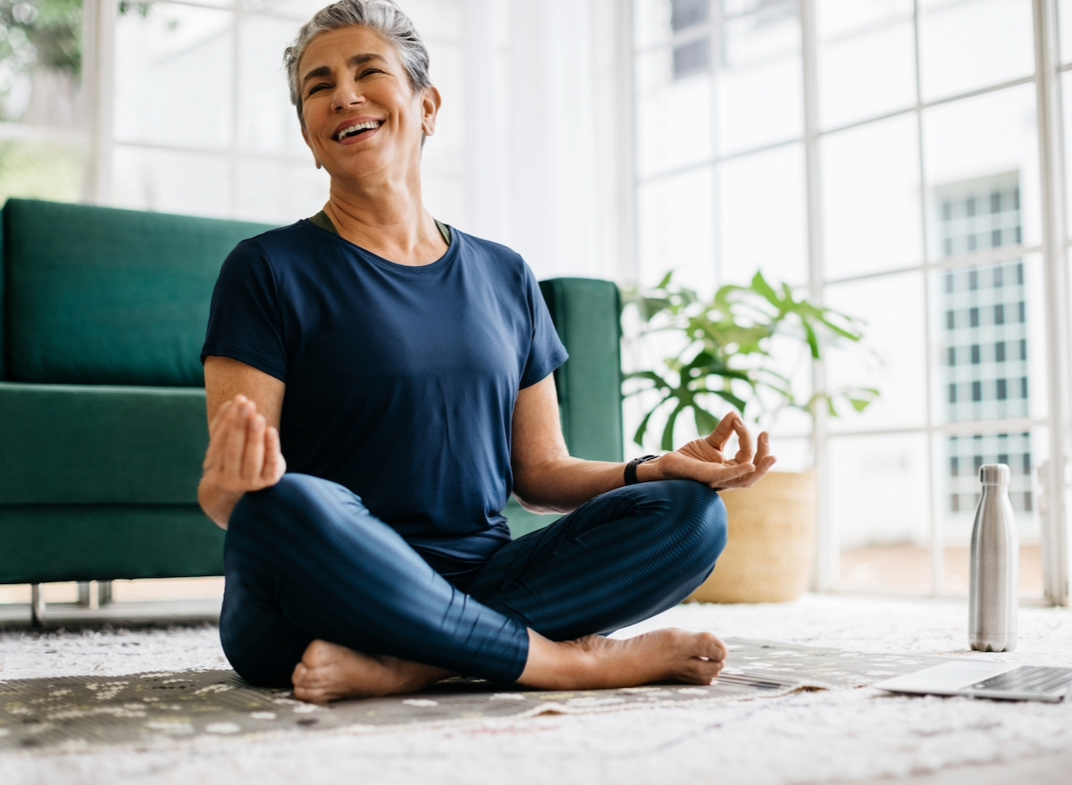 woman meditating, concept of nighttime habits from longest living people