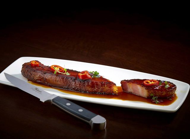 Thick Cut Bacon Au Poivre served in bourbon molasses glaze at Del Frisco's