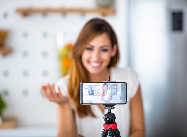 Young woman recording her vlog