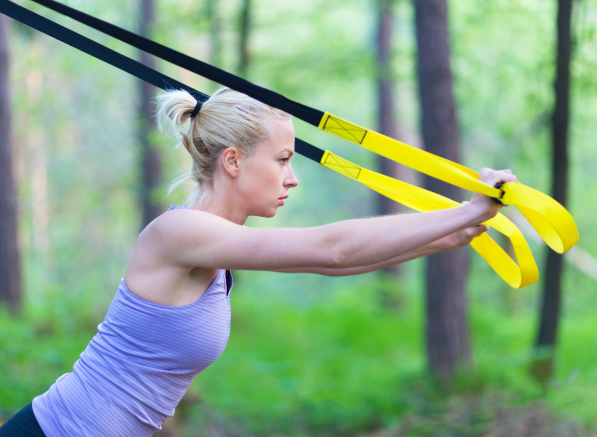 TRX exercise, concept of strength workout for belly fat loss