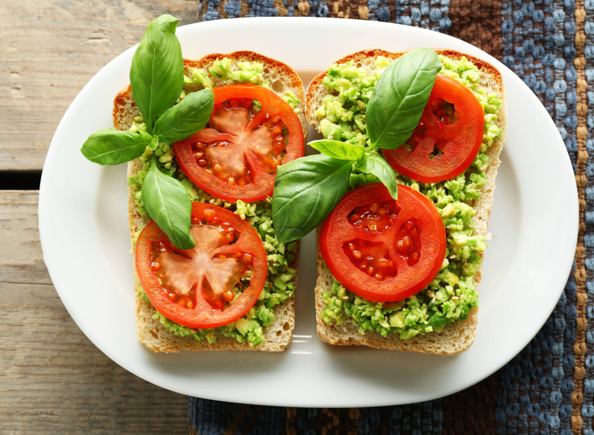 avocado toast with tomatoes, concept of Mediterranean diet snacks for weight loss