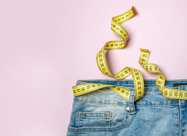 tape measure on jeans, belly fat loss, concept of ways to keep belly fat under control