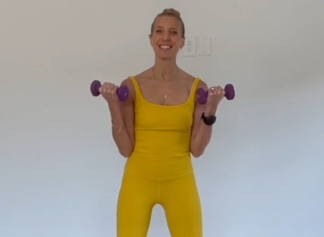 fitness trainer doing bicep curls