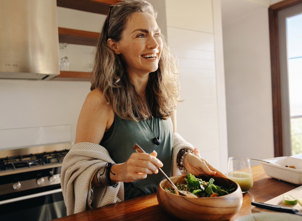 happy woman making healthy meal, concept of easy daily habits for weight loss
