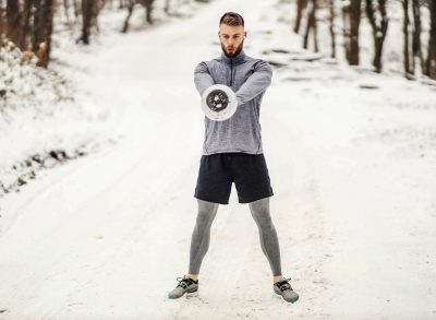 man doing kettlebell exercise, concept of daily workout to lose weight and build muscle