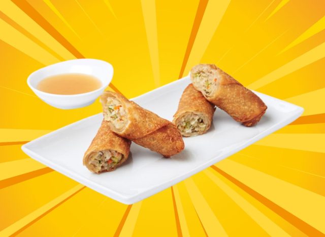 pick up stix egg rolls displayed on a plate with a side of sauce against a bright yellow designed background