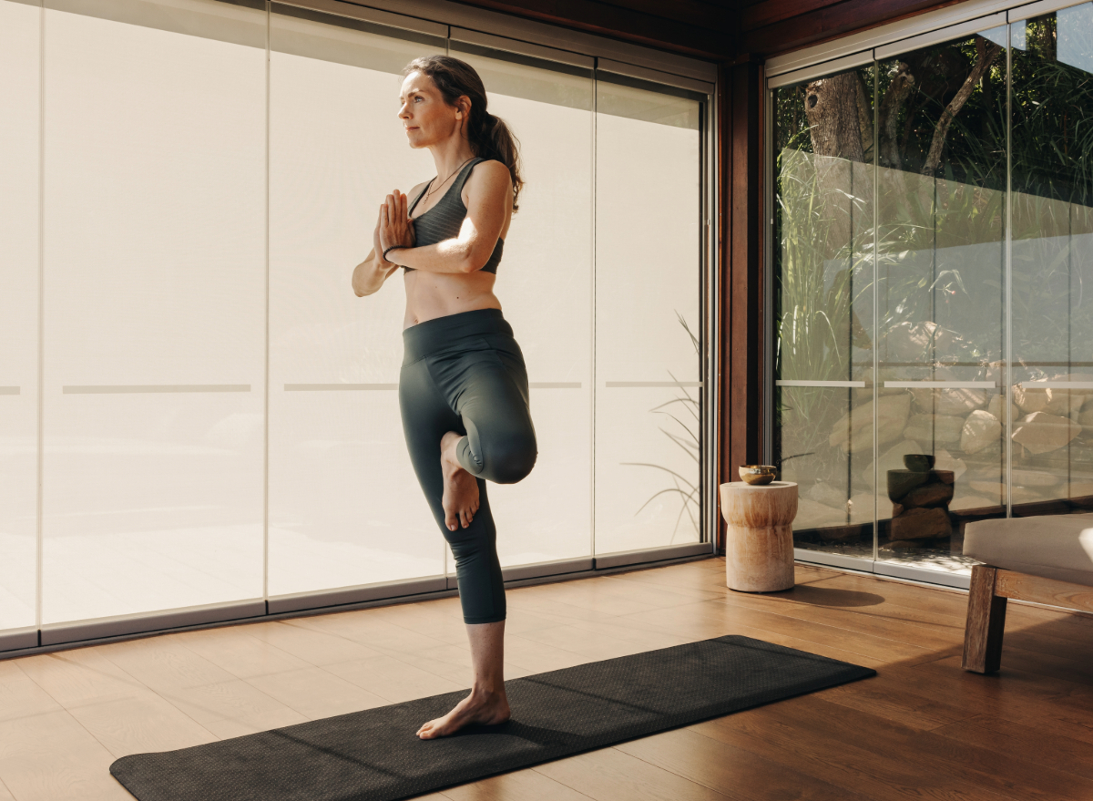 woman doing tree pose balancing exercises