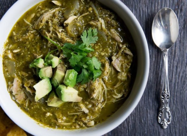 bowl of green chili with spoon