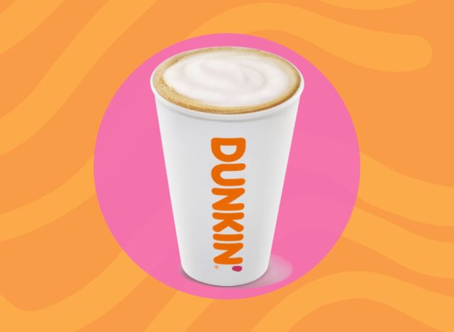 Dunkin' cappuccino over an orange and pink background