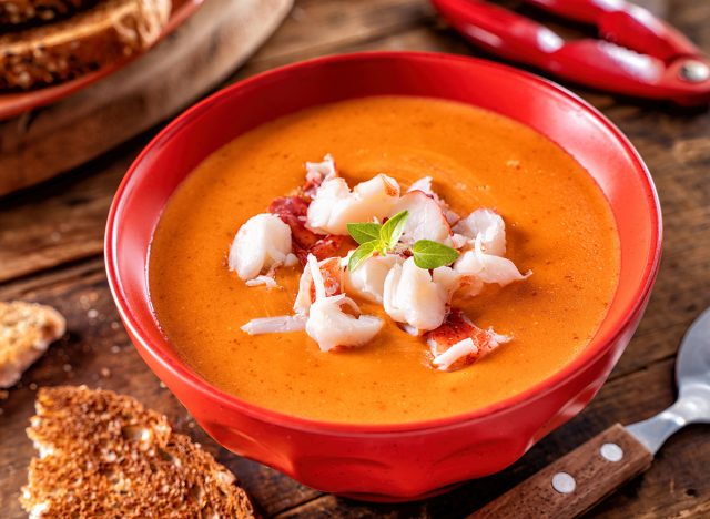 A bowl of delicious creamy lobster bisque with lobster meat