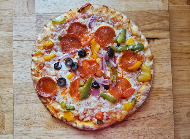 Gluten Free Uncured Pepperoni Pizza with Bell Peppers, Red Onions, Black Olives on a Cauliflower Crust