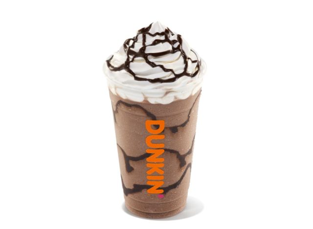 Cup of frozen Dunkin' drink with whipped cream and chocolate drizzle