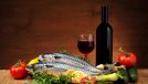 Atlantic Diet concept, fresh fish with wine and veggies