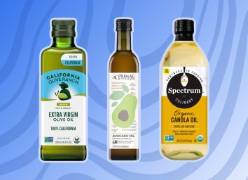 california olive ranch olive oil primal kitchen avocado oil and spectrum canola oil bottles on a designed background