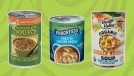 three cans of soup on a green background