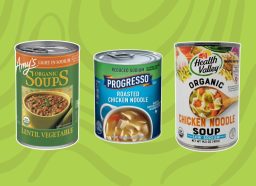 three cans of soup on a green background