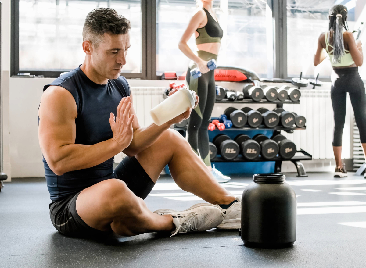 man making protein shake, concept of bad habits to lose muscle mass