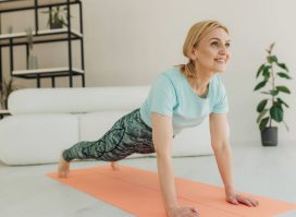 mature woman doing planks, pushups, or burpees, concept of exercises for seniors to do at home