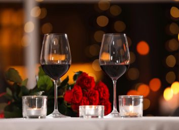 romantic table setting with red wine
