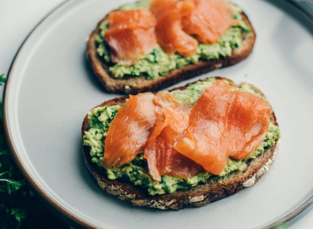 salmon avocado toast on plate, concept of weight-loss breakfasts under 400 calories