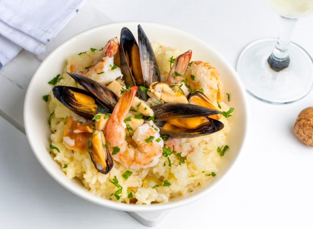 a plate of seafood risotto on a table