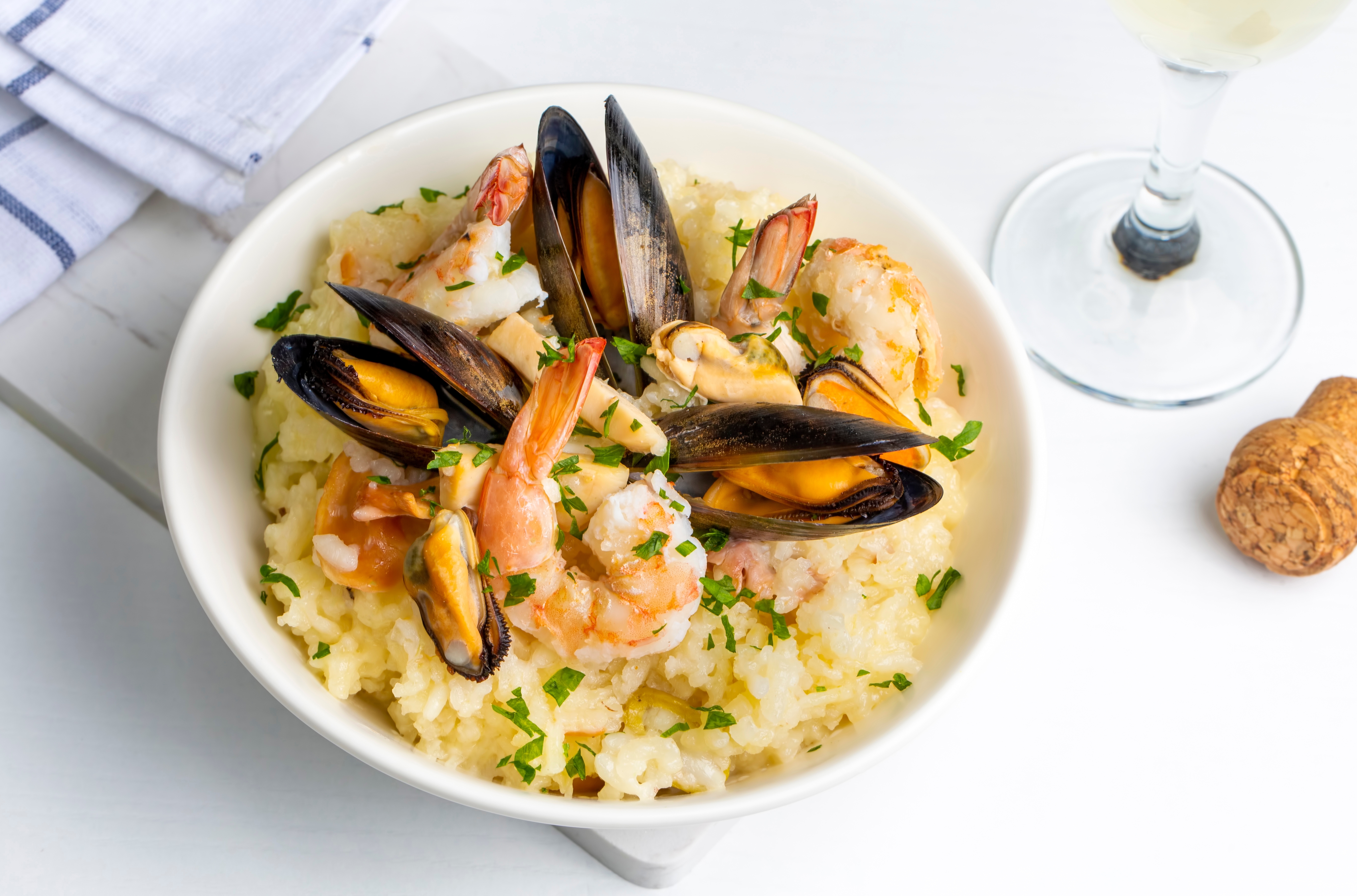 a plate of seafood risotto on a table