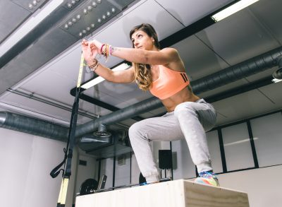 woman doing box jumps, concept of compound exercises for lean lower body