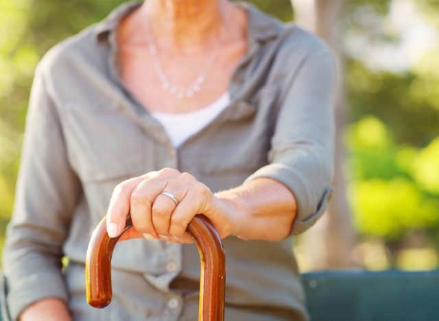 woman holding cane