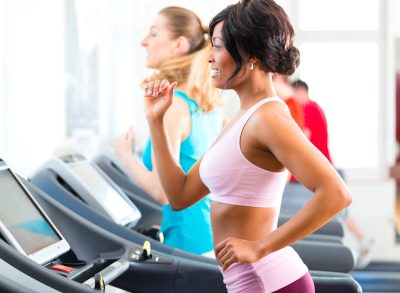 fit woman working out on treadmill, concept of beginner treadmill workout for weight loss