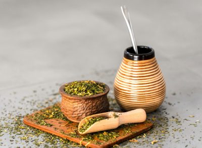 yerba mate in gourd and leaves, concept of yerba mate for weight loss