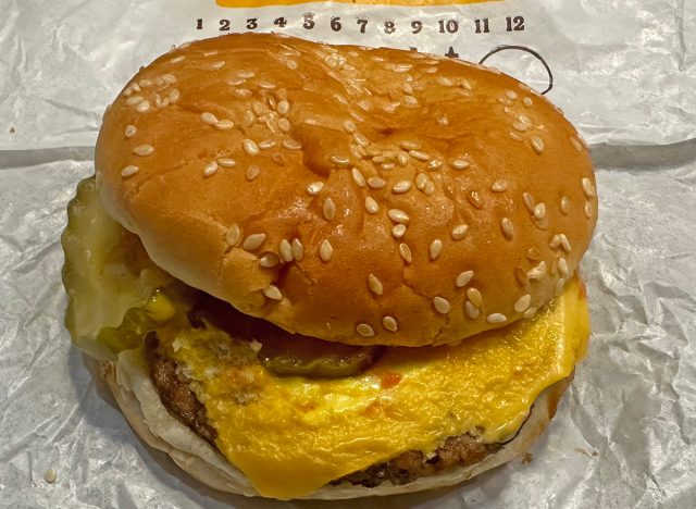 Burger King cheeseburger atop its wrapper