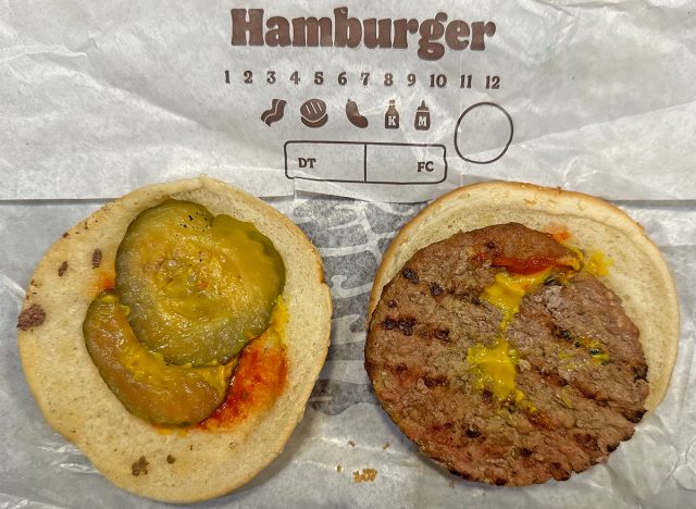 Burger King hamburger open faced atop its wrapper