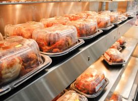 Costco rotisserie chickens lined up on shelves
