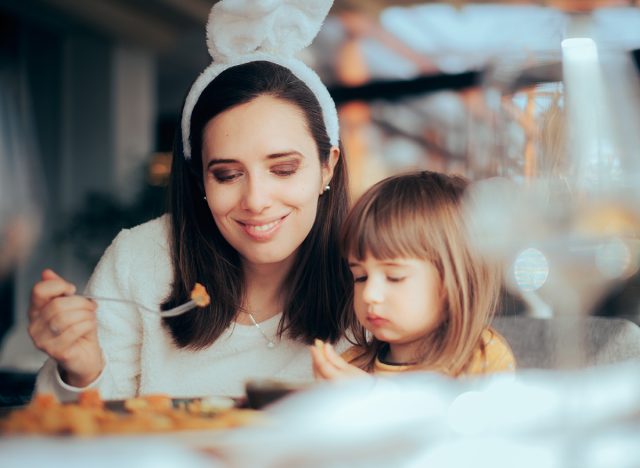 Mother and Daughter Eating Together Celebrating Easter