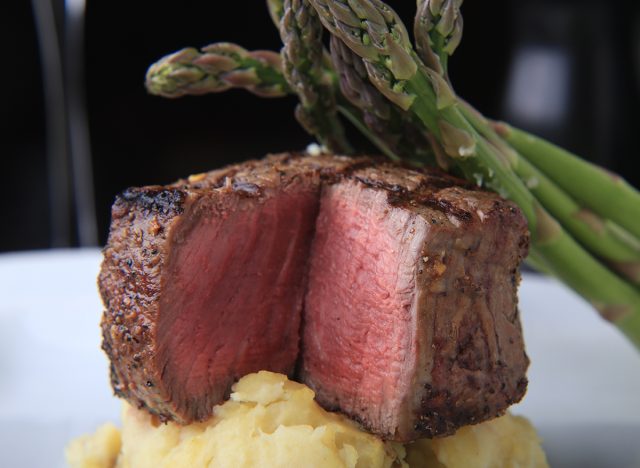 Center Cut Filet Mignon served with Garlic Mashed Potatoes and Asparagus at a steakhouse