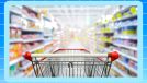 Shopping cart in grocery store with gradient blue background