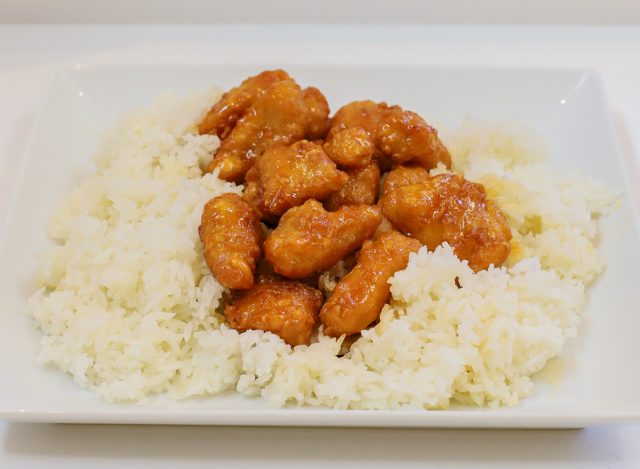 a plate of orange chicken and rice at Thai Express restaurant