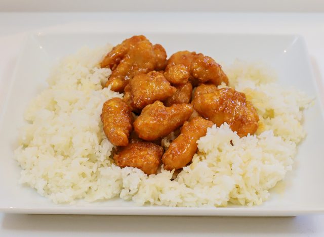 a plate of orange chicken and rice at Thai Express restaurant