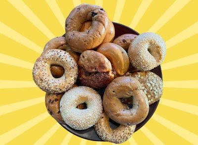 A spread of various bagels from Panera Bread against a colorful background
