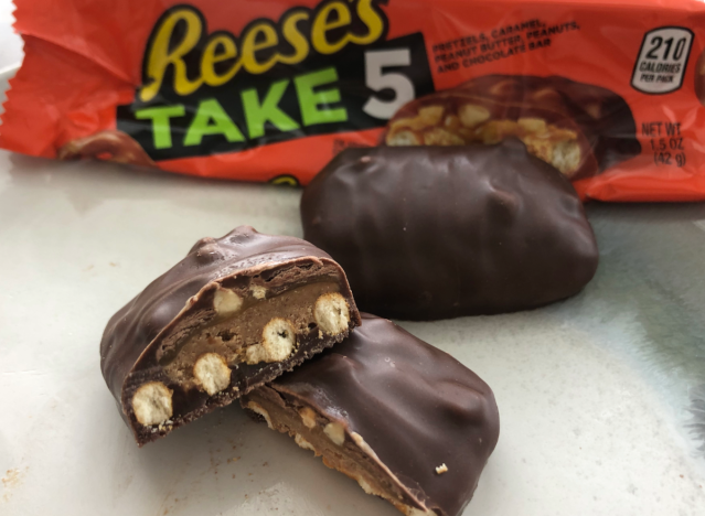reeses take 5 candy broken open revealing the inside.