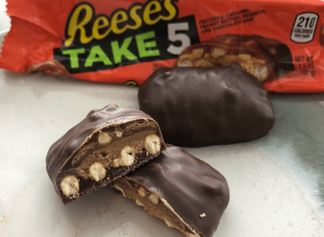 reeses take 5 candy broken open revealing the inside.